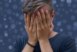 Boy covering face with hands Boy covering face with hands