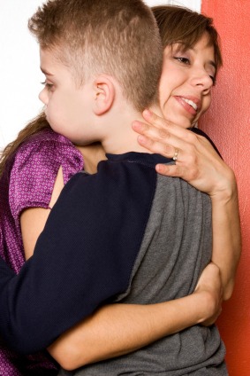 Mother hugging son Mother hugging son