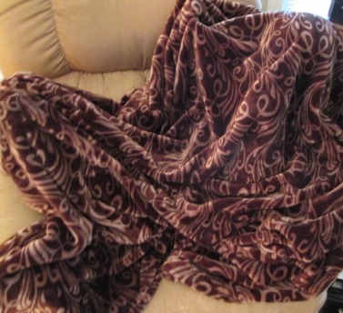 Wrapped in his blanket